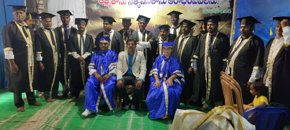 Bible College graduates celebrating outdoors after the ceremony