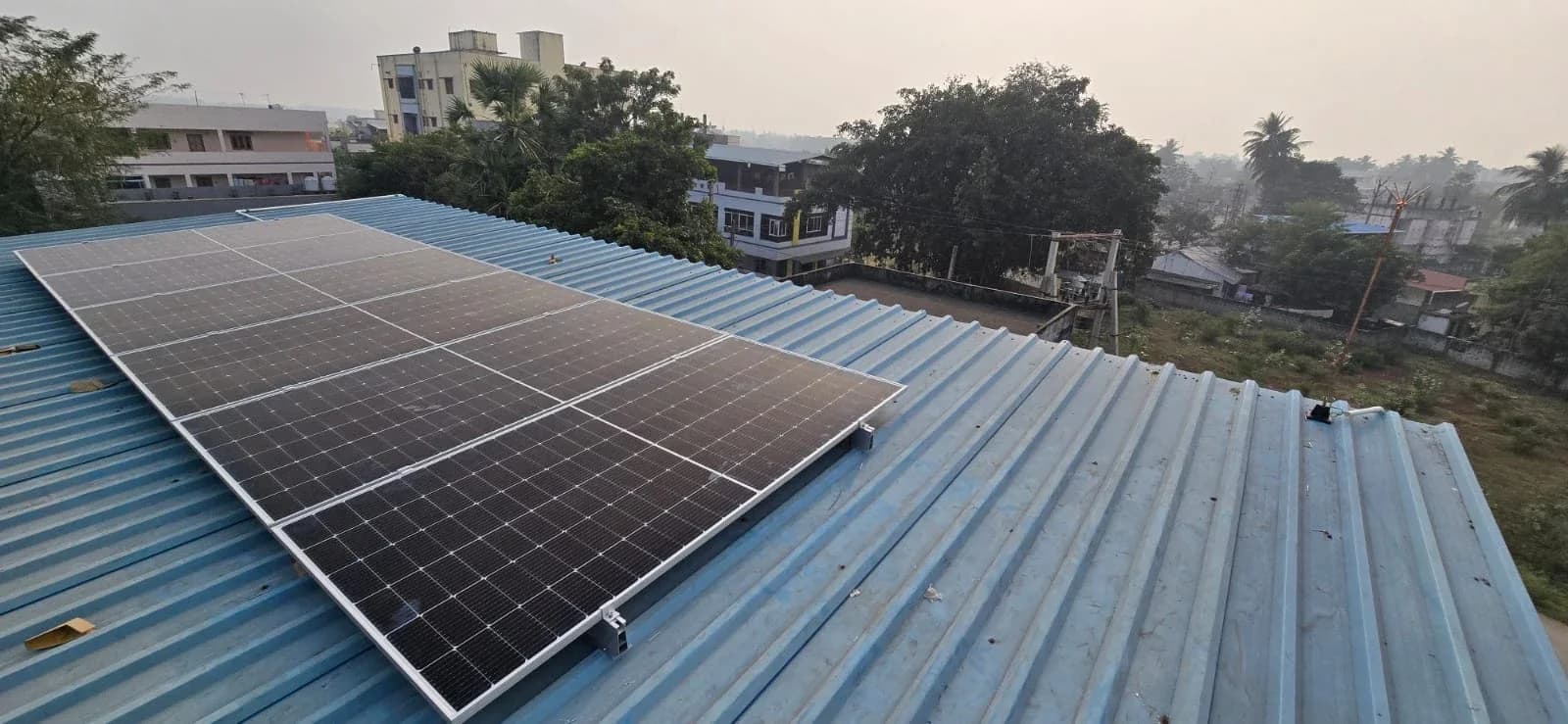 Solar panel installation workers on rooftop